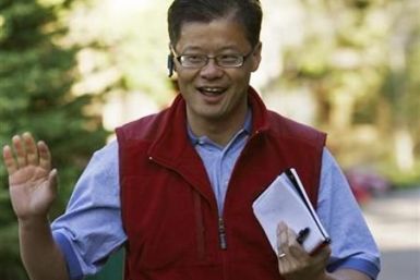 Jerry Yang, CEO of Yahoo! Inc waves at photographers as he arrives at the 26th annual Allen & Co conference in Sun Valley