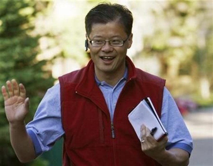 Jerry Yang, CEO of Yahoo! Inc waves at photographers as he arrives at the 26th annual Allen & Co conference in Sun Valley