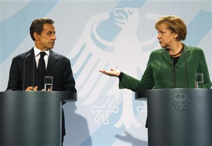 French President Sarkozy and German Chancellor Merkel address a news conference at the Chancellery in Berlin