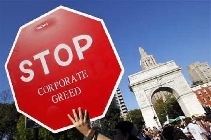 A protester holds a sign during an &#039;&#039;Occupy Wall Street&#039;&#039; rally in New York&#039;s Washington Square