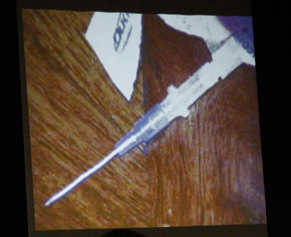 A syringe found in the bedroom of pop star Michael Jackson is shown in this photo projected on a screen during Dr. Conrad Murrays trial in Los Angeles
