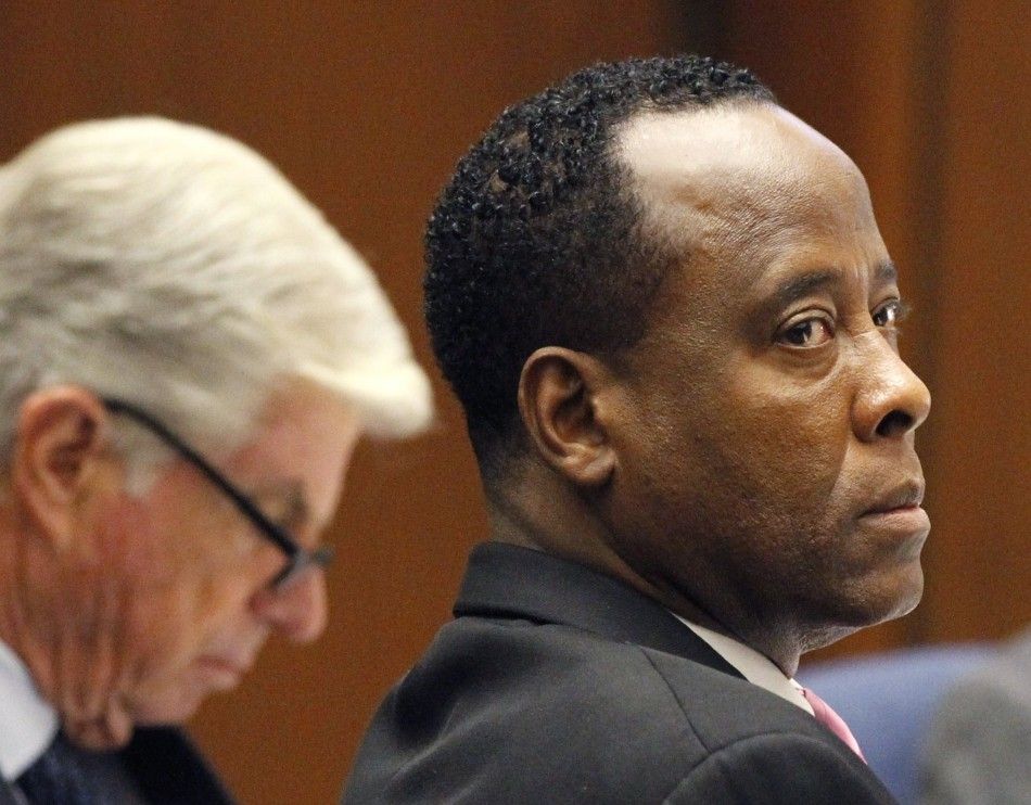 Dr. Conrad Murray sits at the defense table with his attorney J. Michael Flanagan during his trial in the death of pop star Michael Jackson in Los Angeles