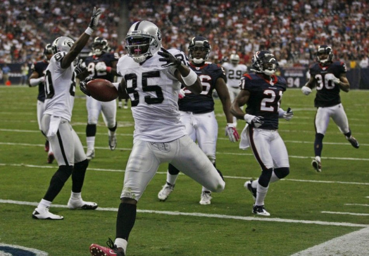 Oakland Raiders wide receiver Heyward-Bey crosses the goal line as he scores a touchdown against the Houston Texas during their NFL football game in Houston