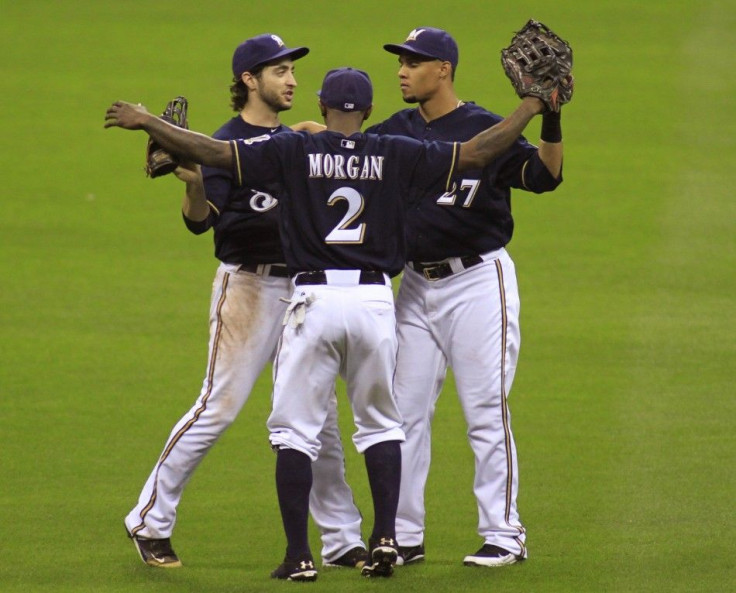 Milwaukee Brewers Ryan Braun, Nyjer Morgan and Carlos Gomez celebrate defeating the St. Louis Cardinals in Game 1 of the MLB National League Championship Series baseball playoffs in Milwaukee