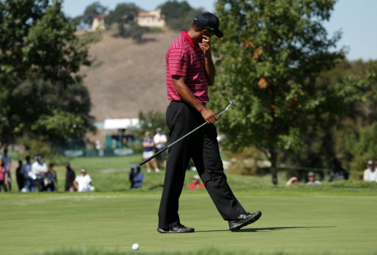 Tiger Woods reacts after missing a birdie putt at the third hole during the final round of a PGA Tour golf tournament in San Martin