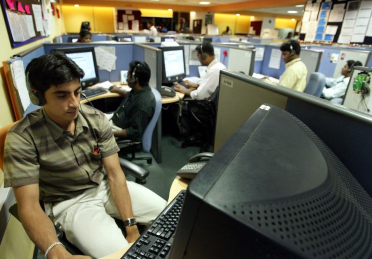 INDIAN EMPLOYEES AT CALL CENTRE PROVIDE INTERNATIONAL CUSTOMER SUPPORT IN BANGALORE.