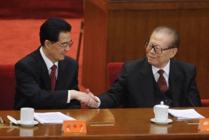China's President Hu Jintao shakes hands with former President Jiang Zemin at the commemoration of the 100th anniversary of the Xinhai Revolution in Beijing