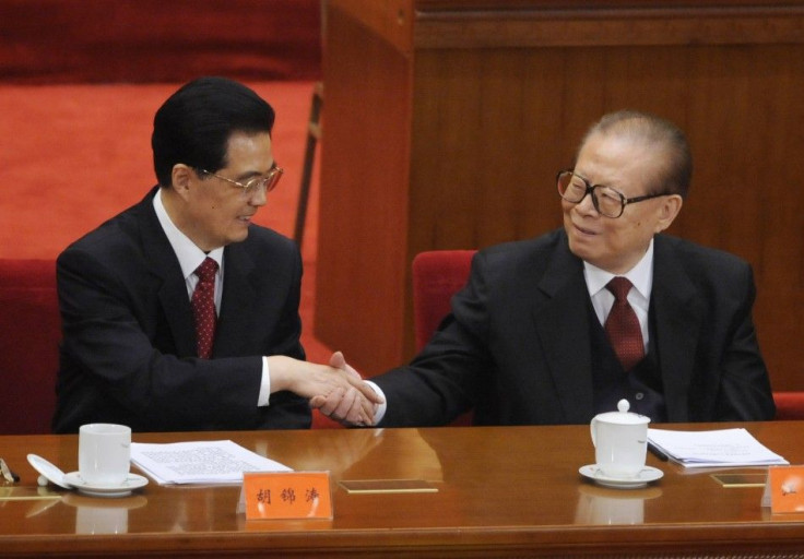 China's President Hu Jintao shakes hands with former President Jiang Zemin at the commemoration of the 100th anniversary of the Xinhai Revolution in Beijing