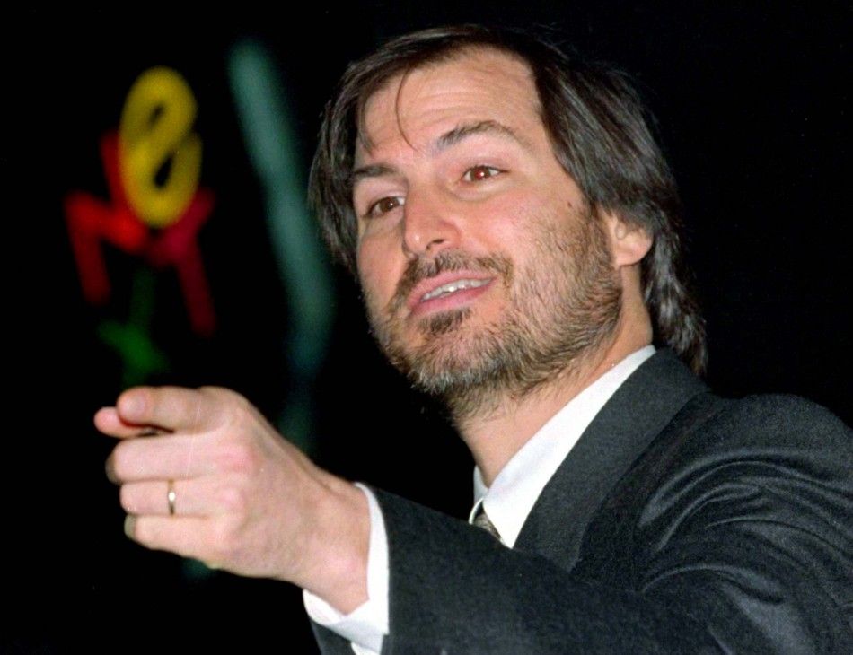 File photo of Apple Inc CEO Steve Jobs waving at the conclusion of the launch of the iPad 2 on stage during an Apple event in San Francisco