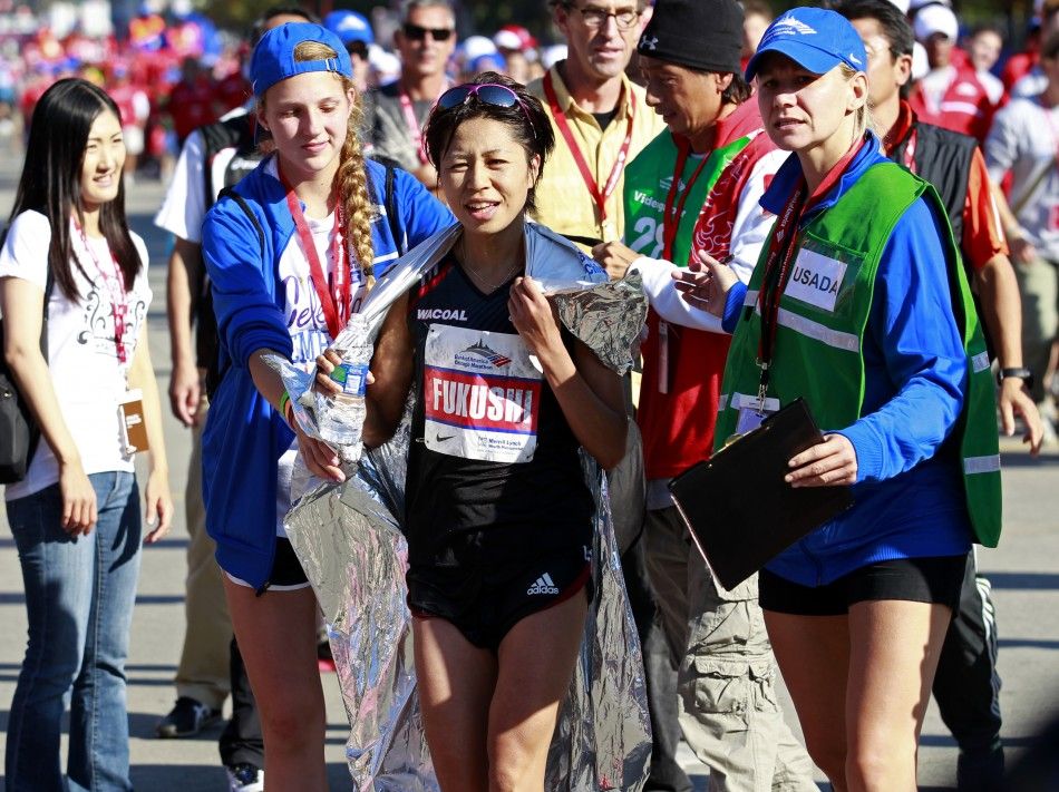 Kayoko Fukushi of Japan smiles after finishing third in the Chicago Marathon