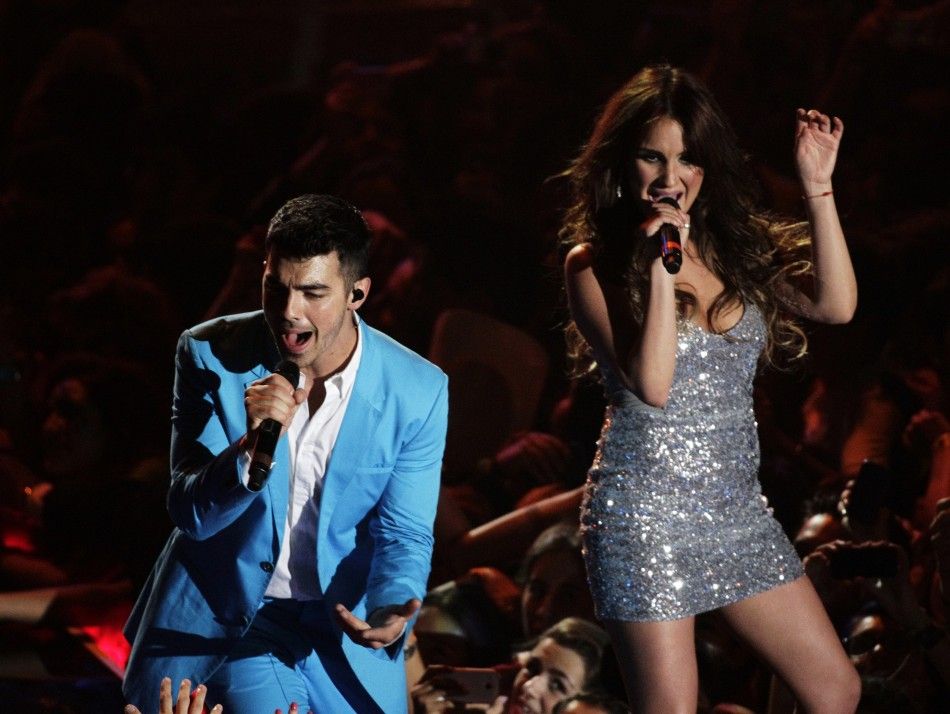 Jonas performing with Mexican singer Maria.