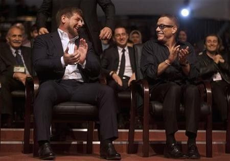 Chechen President Ramzan Kadyrov (L) and Belgian actor Jean-Claude Van Damme share a joke during a ceremony to mark Kadyrov's 35th birthday in the Chechen capital Grozny
