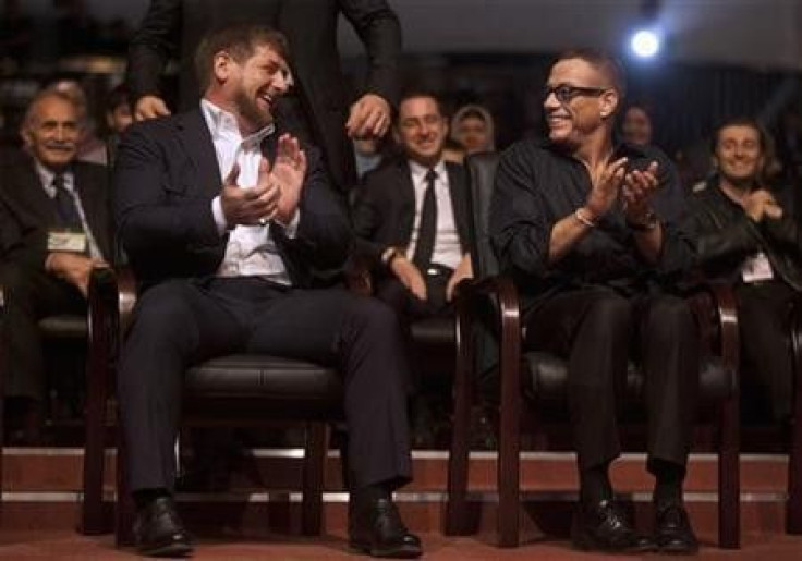 Chechen President Ramzan Kadyrov (L) and Belgian actor Jean-Claude Van Damme share a joke during a ceremony to mark Kadyrov&#039;s 35th birthday in the Chechen capital Grozny