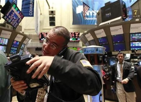 Traders work on the floor of the New York Stock Exchange