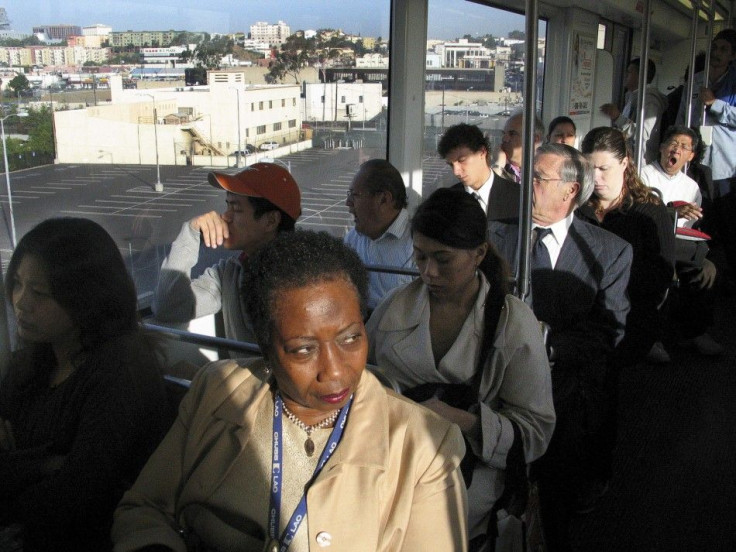 Commuters ride a Los Angeles Metro Gold Line train to Los Angeles