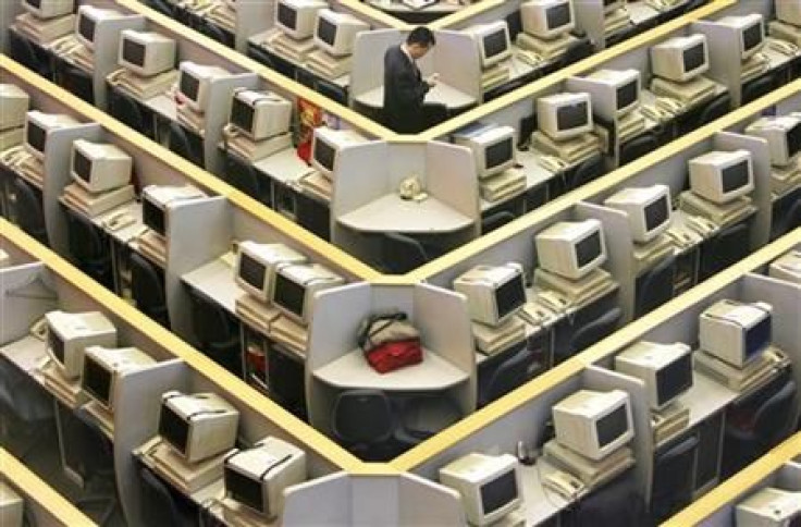 Man works in trading room of Shanghai Stock Exchange during ceremony marking initial public offering of ICBC