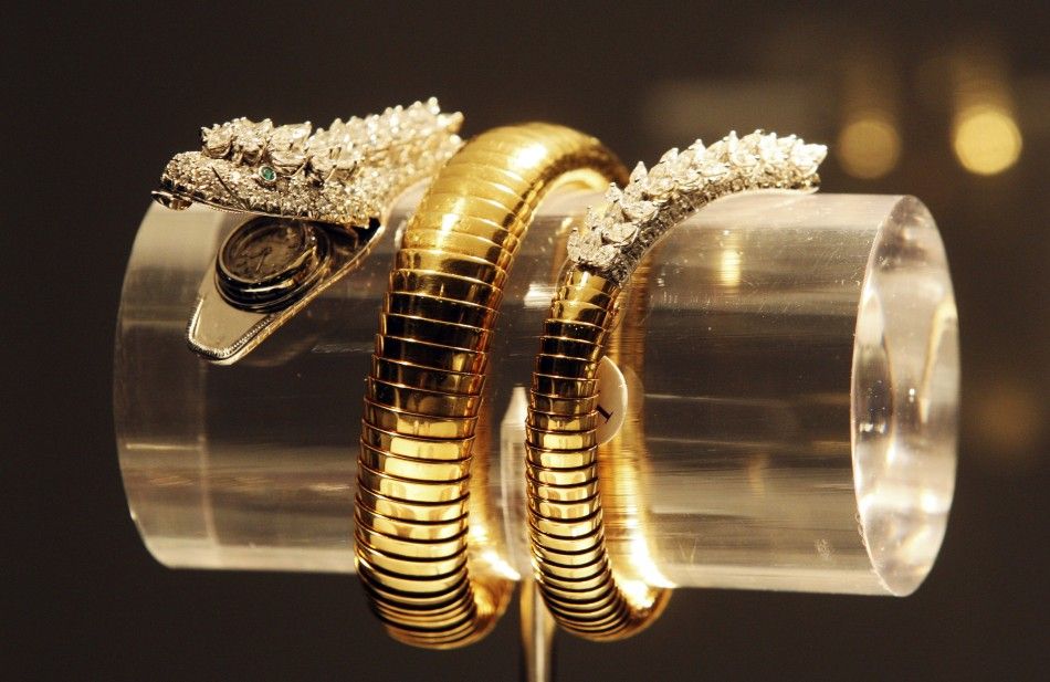 A diamond and emerald snake braceletwatch by Bvlgari.