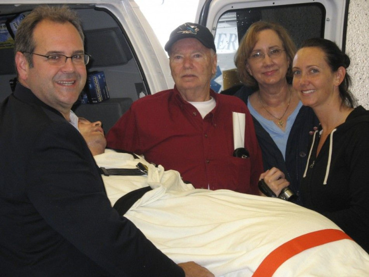 Bryan Stow, who was the victim of an assault on opening day at Dodger Stadium, is shown with his family and doctor as he is transferred from San Francisco General Hospital to an unnamed rehabilitation facility in this publicity photo released to Reuters