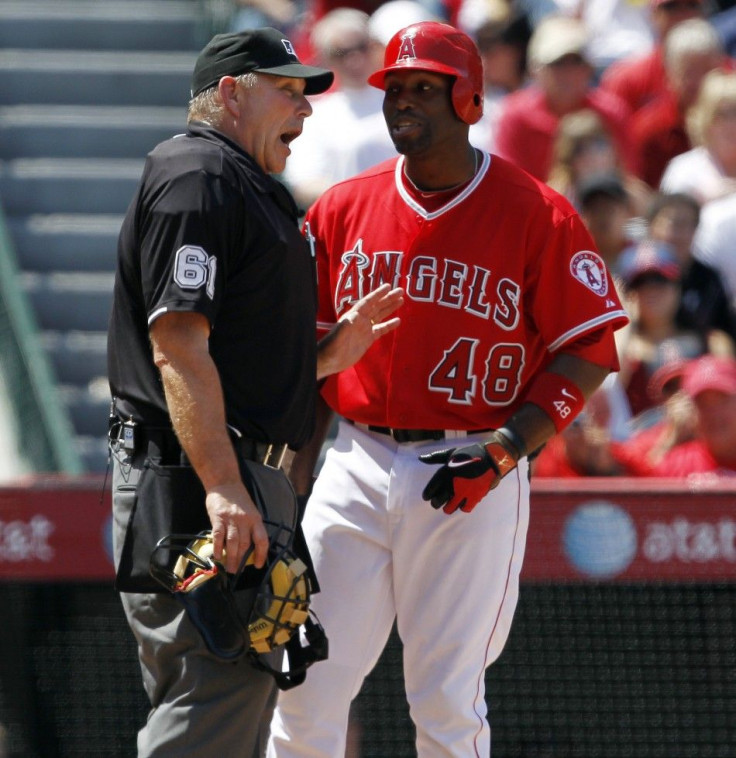 Bob Davidson argues with Torii Hunter after a called strike 3.