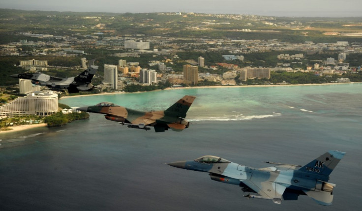 Airplanes fly in formation over Tumon, Guam