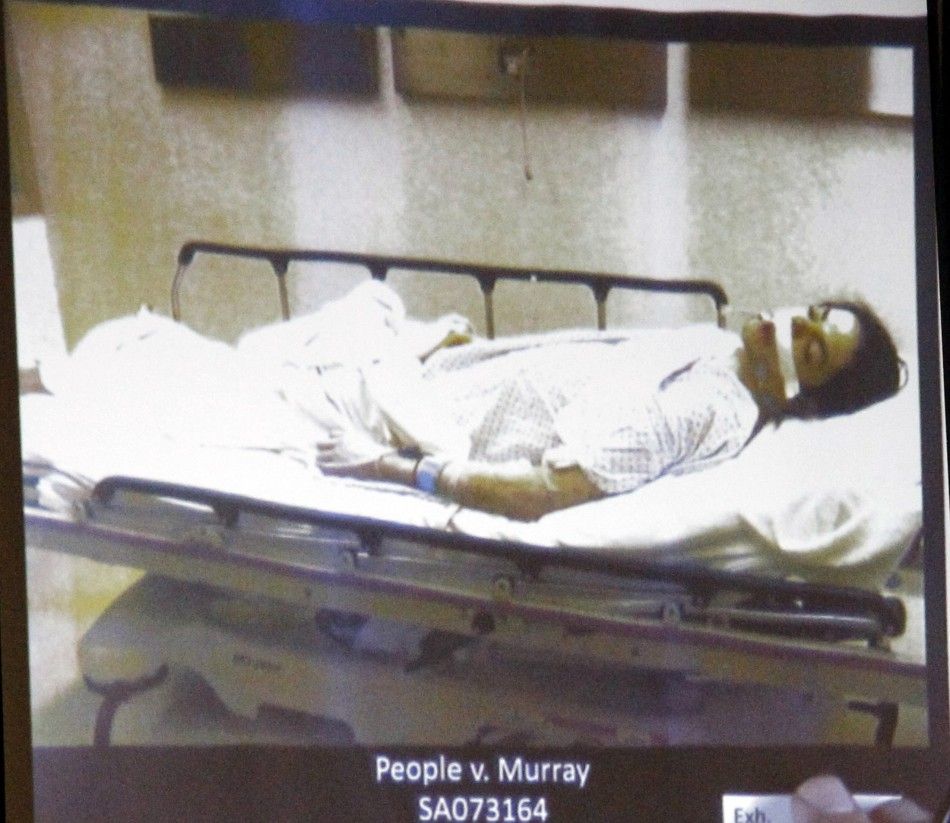 Pop star Michael Jackson lies dead on a gurney in this evidence photo projection at Dr. Conrad Murrays trial in Jacksons death in Los Angeles