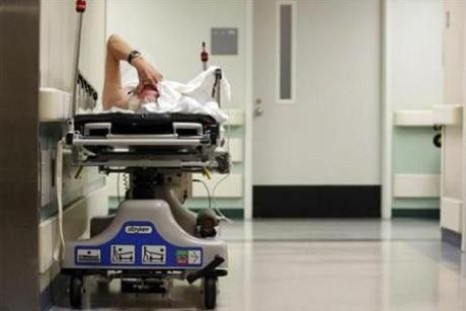 A patient waits in the hallway for a room to open up in the emergency room at Ben Taub General Hospital in Houston, Texas, July 27, 2009. 