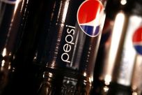 Bottles of Pepsi cola are seen in a display at PepsiCo's 2010 Investor Meeting event in New York