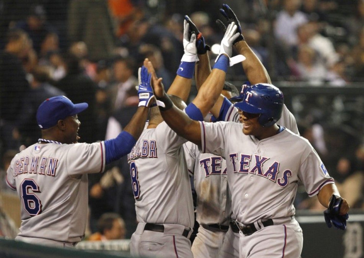 Texas Rangers' Nelson Cruz celebrates with teammates after he hit a three run home run against the Detroit Tigers during the eleventh inning of Game 4 in their MLB American League Championship Series baseball playoffs in Detroit