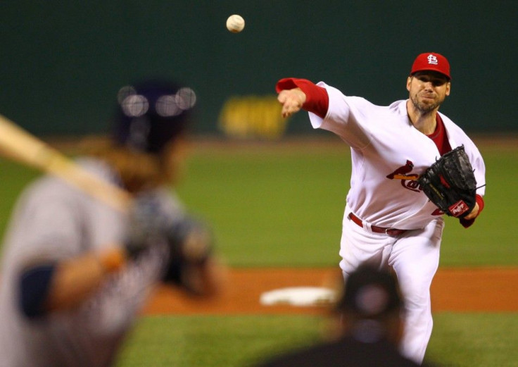 St. Louis Cardinals starting pitcher Chris Carpenter throws to Milwaukee Brewers&#039; Corey Hart in the 1st inning of Game 3 of the MLB National League Championship Series baseball playoffs in St. Louis
