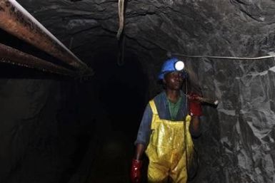 A Zimbabwean miner works underground