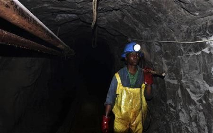 A Zimbabwean miner works underground