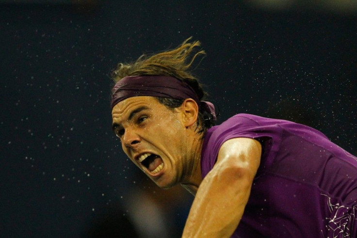 Rafael Nadal of Spain serves to Florian Mayer of Germany during their match at the Shanghai Masters Tennis Tournament in Shangha