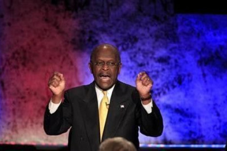 Republican presidential candidate and businessman Herman Cain makes a point while participating in a Republican presidential debate with the other hopefuls at Dartmouth College in Hanover, New Hampshire