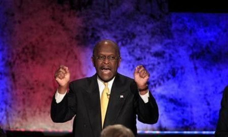 Republican presidential candidate and businessman Herman Cain makes a point while participating in a Republican presidential debate with the other hopefuls at Dartmouth College in Hanover, New Hampshire
