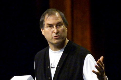 Apple Computer CEO Steve Jobs holds a box containing Apple's new Mac OS X operating system while giving the keynote address at the Apple Worldwide Developers Conference in San Jose, California, May 21, 2001