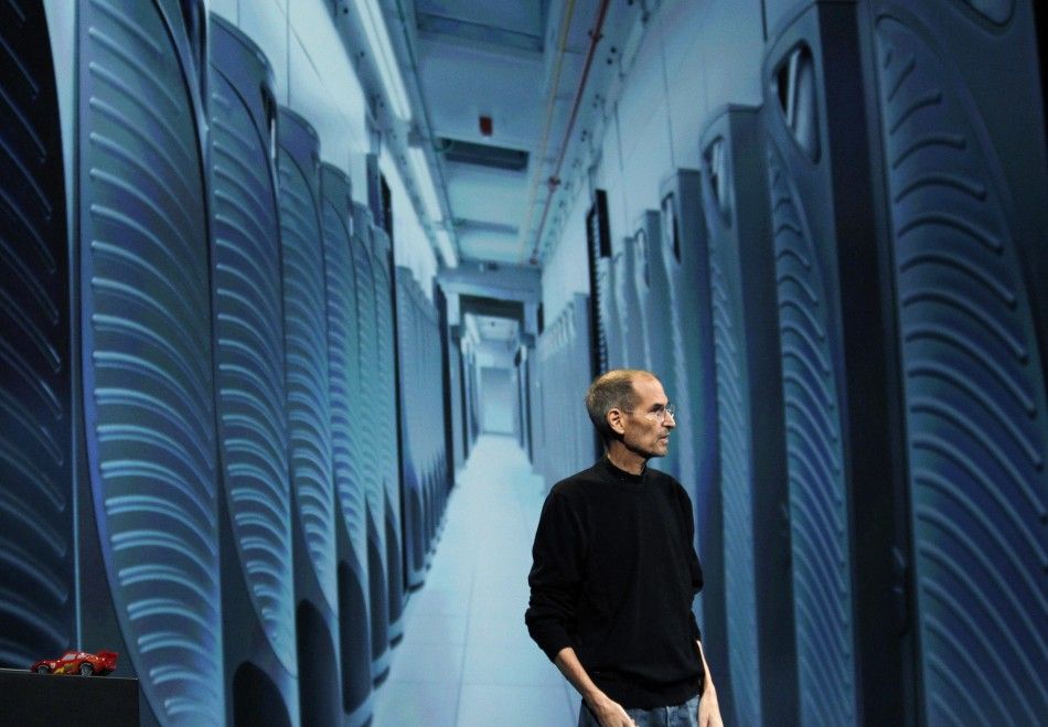 Steve Jobs is pictured with an image of server farm in Maiden, North Carolina as discusses the iCloud service at the Apple Worldwide Developers Conference in San Francisco