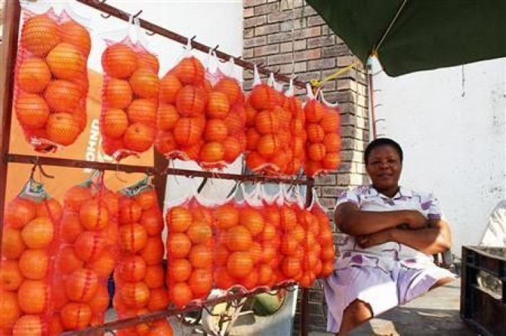 A fruit seller sits at a roadside stall in the diamond mining town of Letlhakane