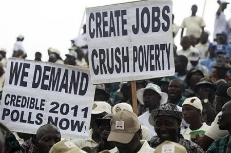 People display placards during a Labour Day parade in Nigeria