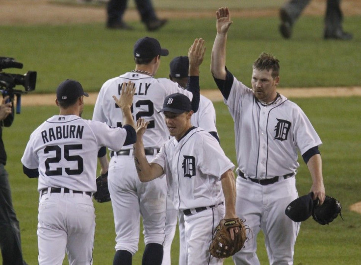 Detroit Tigers players Raburn, Kelly, Inge and Coke celebrate after they defeated the Texas Rangers in their MLB ALCS baseball playoffs in Detroit