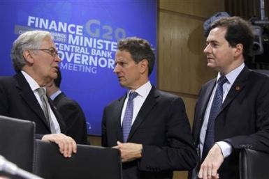 The Governor of the Bank of England Mervyn King talks to US Treasury Secretary Geithner and Britain's Chancellor of the Exchequer George Osborne in Paris
