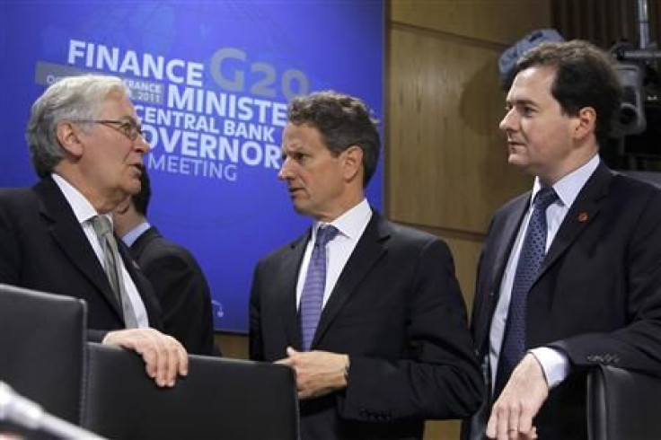 The Governor of the Bank of England Mervyn King talks to US Treasury Secretary Geithner and Britain's Chancellor of the Exchequer George Osborne in Paris