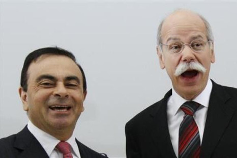 Dieter Zetsche (R), chief executive officer of German car manufacturer Daimler AG, shakes hands with Carlos Ghosn (L), chief executive officer of Renault-Nissan Alliance, before signing an agreement in Brussels, April 7, 2010. 