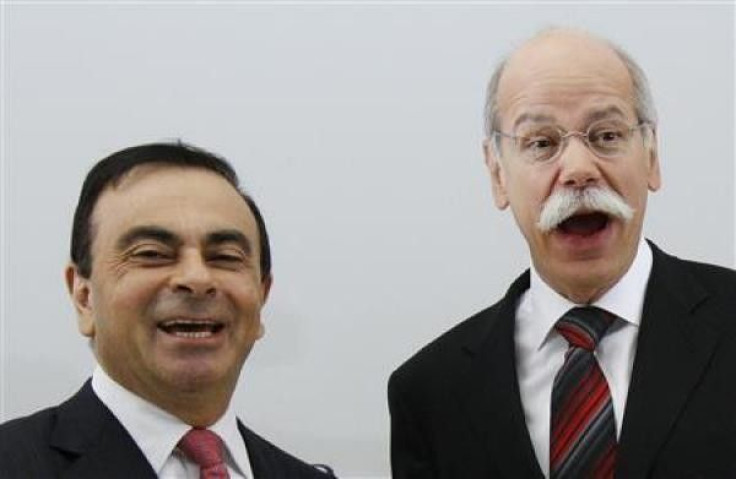 Dieter Zetsche (R), chief executive officer of German car manufacturer Daimler AG, shakes hands with Carlos Ghosn (L), chief executive officer of Renault-Nissan Alliance, before signing an agreement in Brussels, April 7, 2010. 