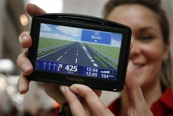 Model displays new TOMTOM Go navigation device during first public day at the CeBIT computer fair in Hanover