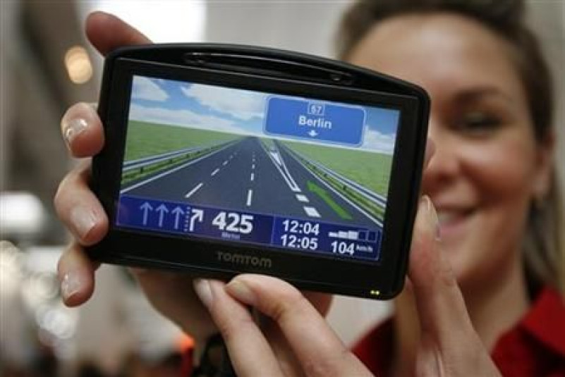 Model displays new TOMTOM Go navigation device during first public day at the CeBIT computer fair in Hanover