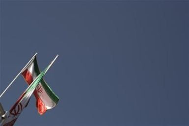 Iranian flags are pictured on the roof of the presidential office in Tehran