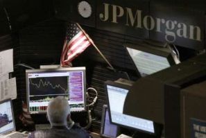 A trader works in the J.P. Morgan stall on floor of the New York Stock Exchange, September 14, 2009. 