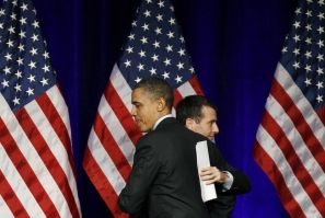U.S. President Barack Obama gets a hug from senior advisor David Plouffe 