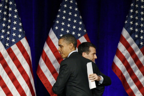 U.S. President Barack Obama gets a hug from senior advisor David Plouffe 