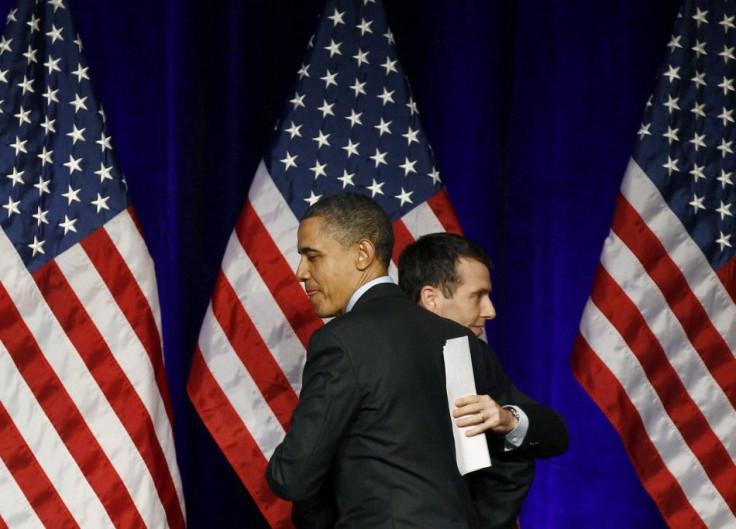 U.S. President Barack Obama gets a hug from senior advisor David Plouffe